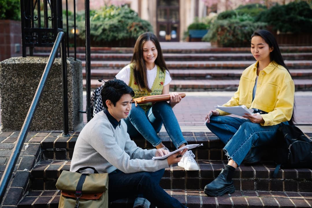 Students studying together on campus steps
