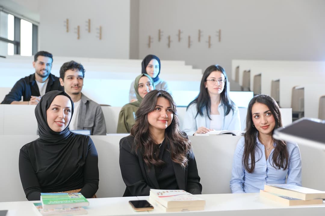 Students studying in a university lecture hall